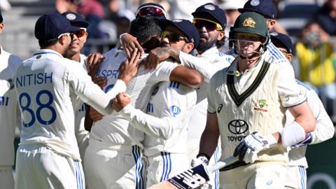 Australia's Steve Smith walks off after being dismissed by India's Jasprit Bumrah