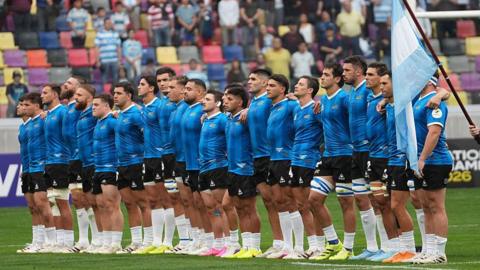 Argentina lining up in their replica 1986 World Cup shirts