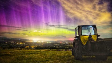 Picture of  aurora display over the Vale of Clwyd, in Denbighshire, watched by a vintage David Brown farm tractor