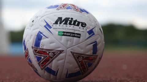 National League football on an athletics track