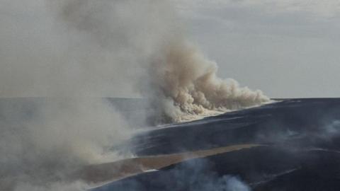An image of a large amount of white smoke rising from a moorland which is on fire in West yorkshire.