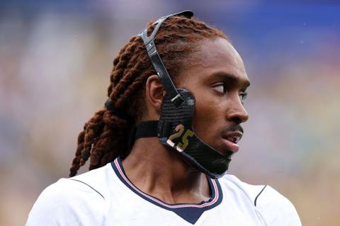 Djed Spence wearing protective mask across jawline.