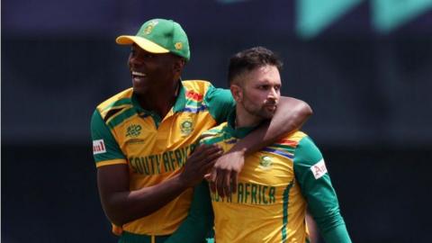 South Africa's Kagiso Rabada (left) and Keshav Maharaj (right) celebrate