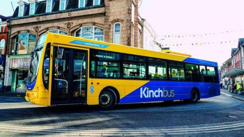A Kinchbus driving through the town centre