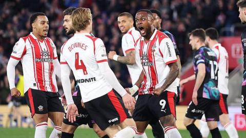 Saints celebrate after scoring