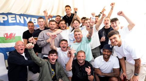 Penybont players and staff celebrate