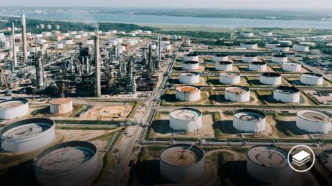 An aerial view photograph of an oil refinery.