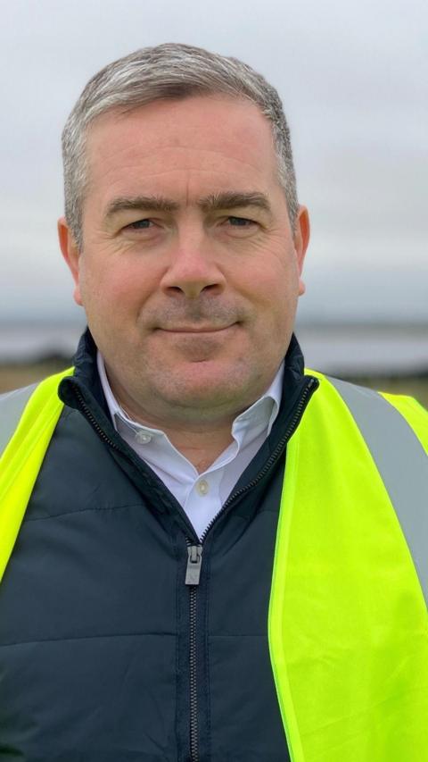 A man wearing a hi-vis jacket
