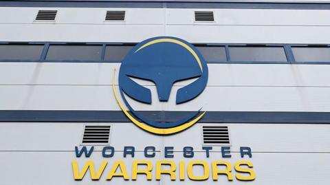 Outside of Worcester Warriors stadium Sixways showing the club name and badge
