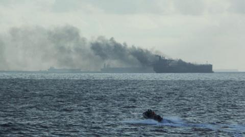 Rescue teams reach oil tankers on fire off the Singaporean island of Pedra Branca