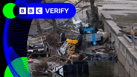 An image showing the flood in Texas. Cars and trees are submerged in water