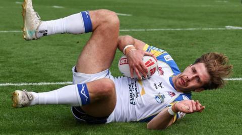 Leeds Rhinos' Paul Momirovski celebrates scoring his side's second try against London Broncos