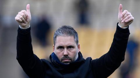 QPR boss Marti Cifuentes raises his thumbs up to the crowd