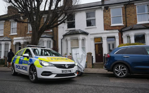 A police car outside a property in Hammersmith