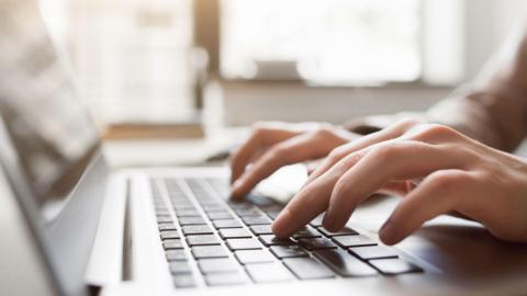 Hands touching a keyboard