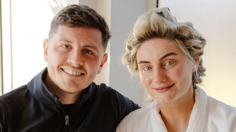 Couple getting wed in casual clothing