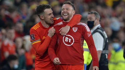 Aaron Ramsey and Chris Gunter embrace after winning a game for Wales