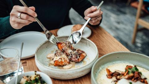 A fancy meal on a table at a restaurant
