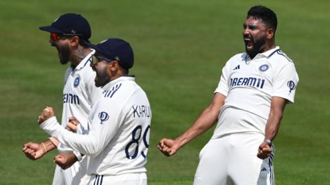 India bowler Mohammed Siraj (right) celebrates taking a wicket