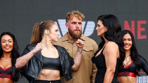 Ronda Rousey and Gina Carano face off either side of Jake Paul