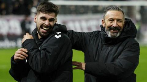 Claudio Braga and Derek McInnes celebrate Hearts' win