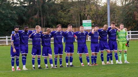 Brantham Athletic players line up on the pitch