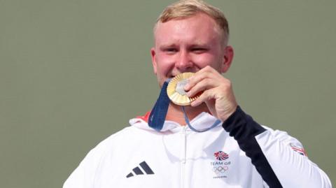 Nathan Hales shows off his gold medal