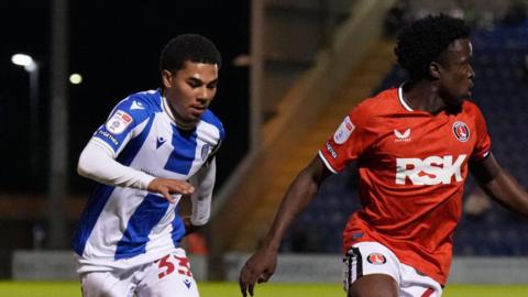 Marley Marshall-Miranda challenges for the ball during a match