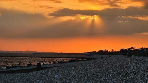 MONDAY - Sunset over the beach with an orange sky at Lee on Solent