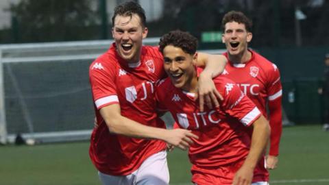 Jersey Bulls players celebrate a goal
