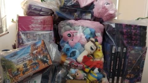 Fake KPop Demon Hunters and Labubu dolls in see-through bags.