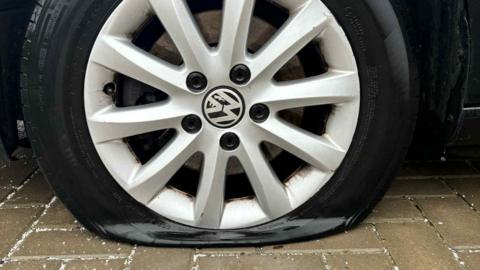 A flat VW car tyre