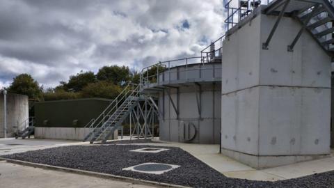 Kelloe Sewage Treatment Works. Metal steps lead up to a new tank.