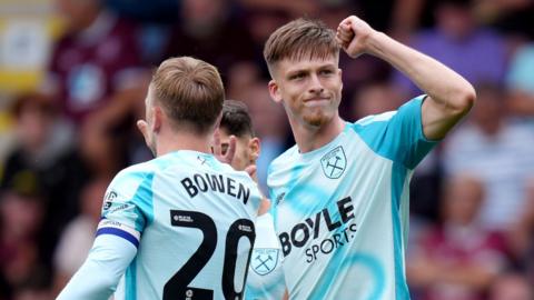 Oliver Scarles clenches his fist in celebration of West Ham goal