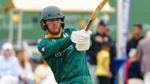 A Guernsey batter in action