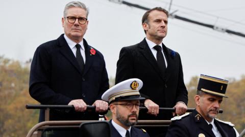 France's President Emmanuel Macron and Britain's Prime Minister Keir Starmer arrive at Place de l'Etoile to attend commemorations marking the 106th anniversary of the 1918 Armistice