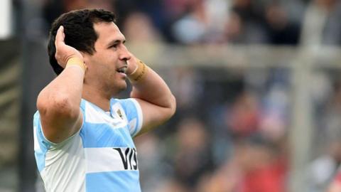 Argentina's Matias Moroni celebrates while cupping his ears