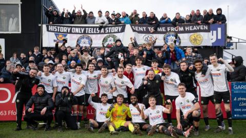Rhyl celebrating a win with fans