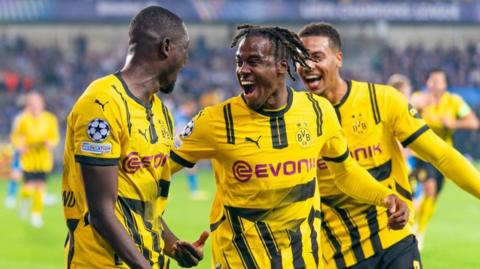 Borussia Dortmund opened with a 3-0 win away to Club Bruges