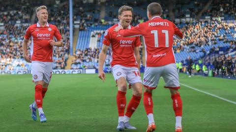 Bristol City's Ross McCrorie and Rob Dickie celebrate with Anis Mehmeti