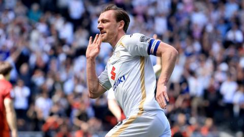 Alex Gilbey celebrates after scoring a second goal for MK Dons