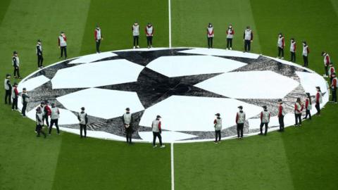 The Uefa Champions League logo sits in the centre circle ahead of a match