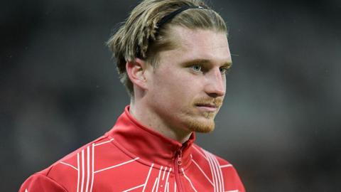 Close up of Dennis Cirkin with red Sunderland training jacket visible to shoulders