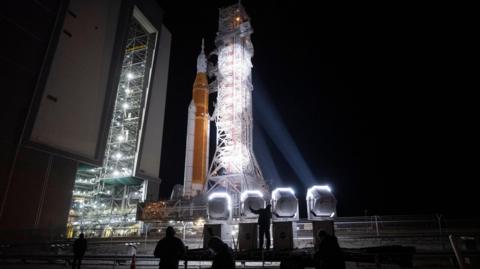 NASA's Space Launch System (SLS) rocket and Orion spacecraft, secured to the mobile launcher, is seen as it rolls out of the Vehicle Assembly Building to Launch Pad 39B, Friday, March 20, 2026, at NASA's Kennedy Space Center in Florida.