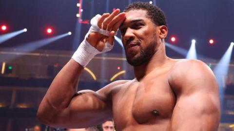 Anthony Joshua salutes the crowd