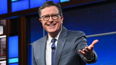 Stephen Colbert presenting The Late Show on Thursday 17 July 17, wearing a blue tie and smiling at the camera