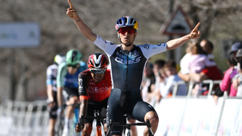 Tom Pidcock celebrates after winning stage two