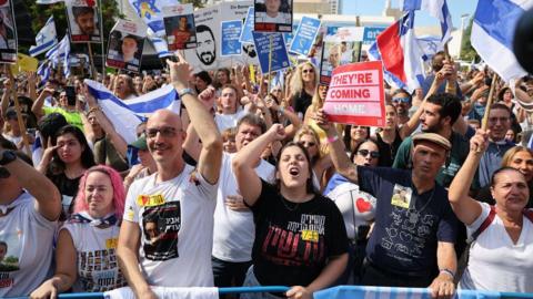 Israelis celebrate the release of hostages held by Hamas in Tel Aviv