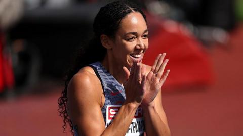 Katarina Johnson-Thompson claps while competing at the European Athletics Championships