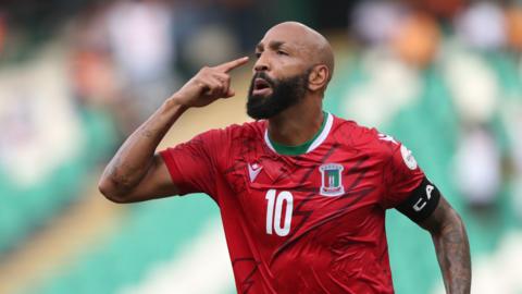 Emilio Nsue celebrates scoring a goal for Equatorial Guinea by pointing to his head